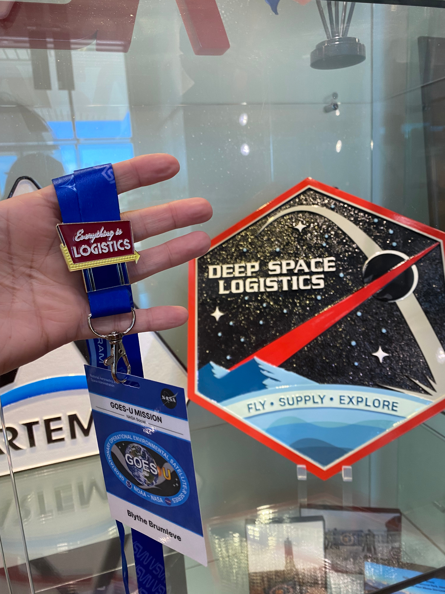 EiL Vegas-style pin held next to NASA's Deep Space Logistics patch